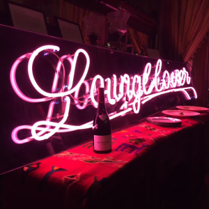 neon sign with champagne